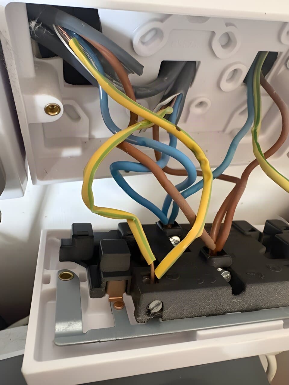 Double socket being wired into its back box